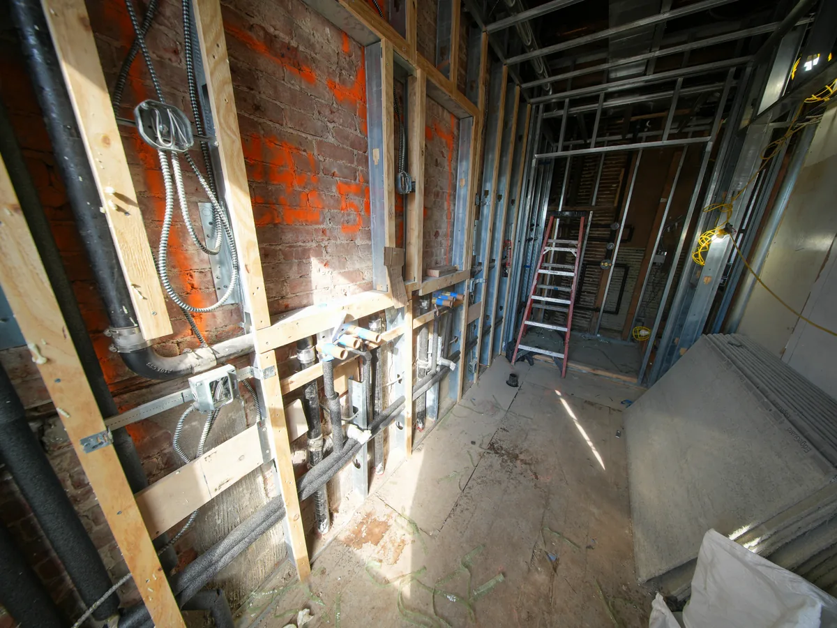 Pro Build estimator performing on-site assessment for basement waterproofing project