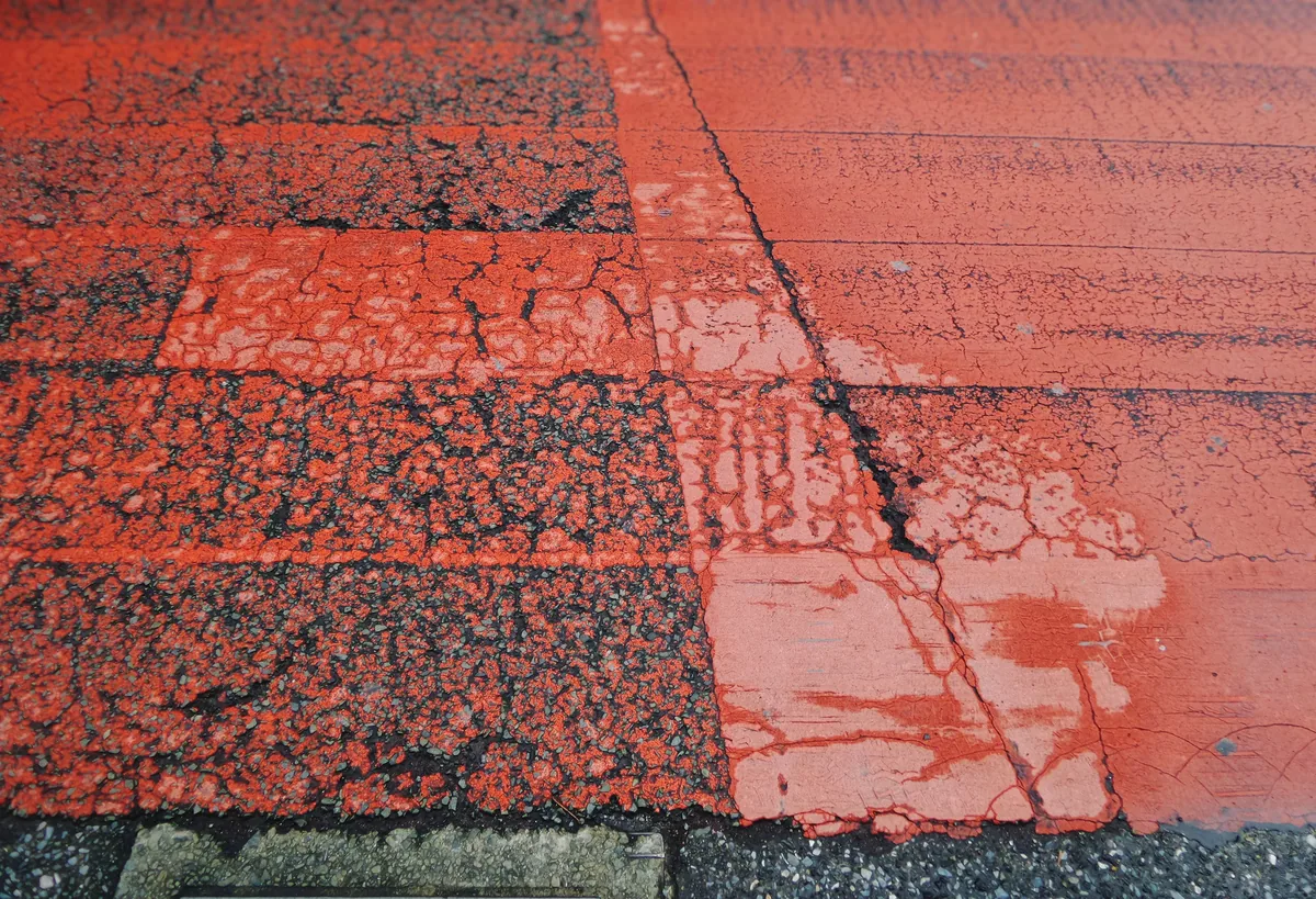 Roofer installing architectural shingles on a Massachusetts home