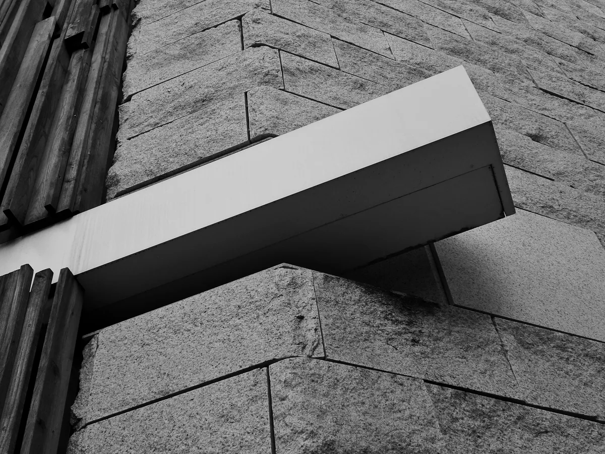 Roofer installing architectural shingles on a Massachusetts home