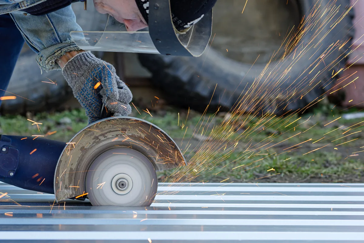 Pro Build estimator performing on-site assessment for metal roofing project