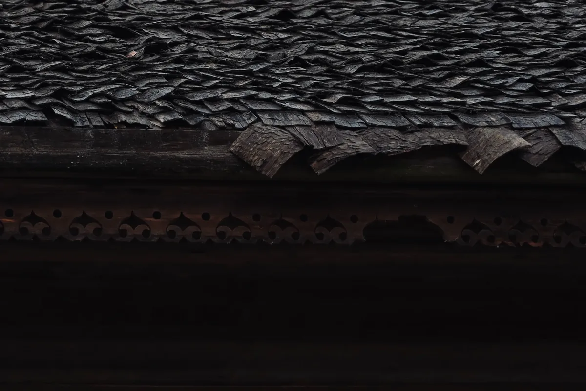 Roofer installing architectural shingles on a Massachusetts home